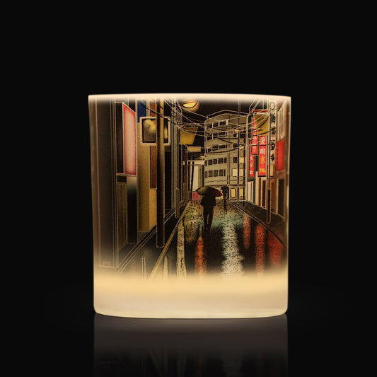 Luxury candle with artwork depicting a rainy night in tokyo