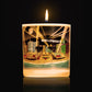 Lit Luxury candle with artwork of famous hollywood landmarks