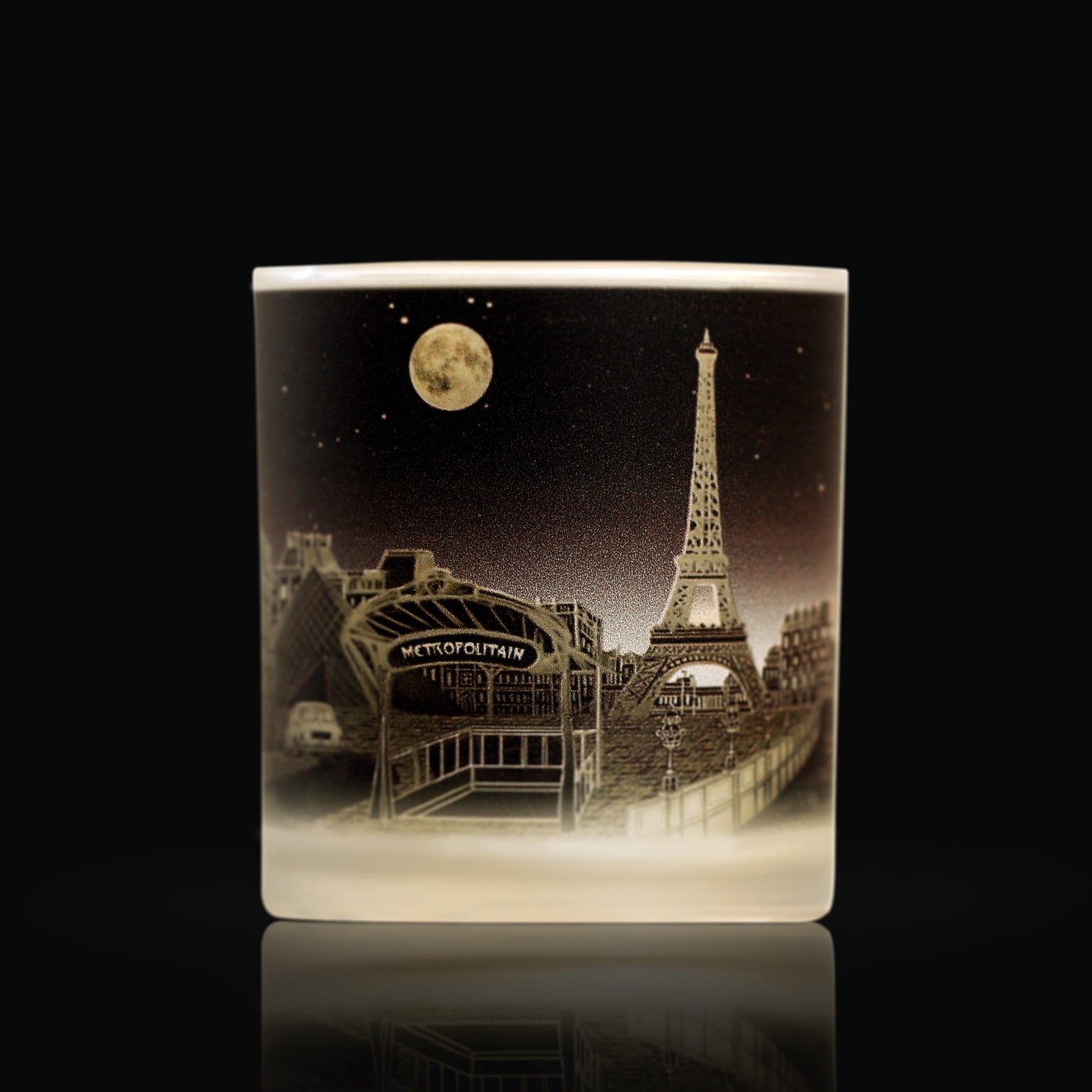 Luxury candle with art depicting iconic Parisian sites