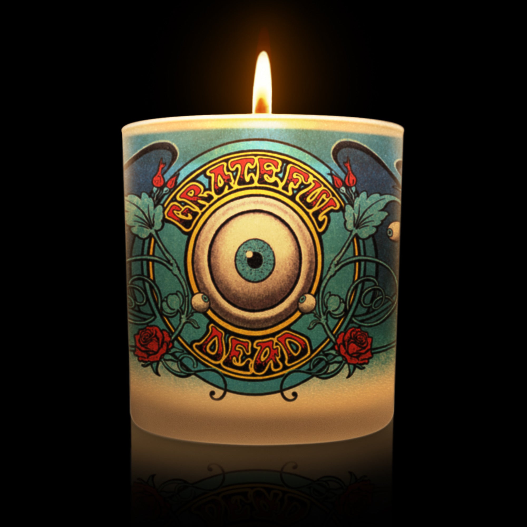 Lit candle featuring the Grateful Dead eye design.