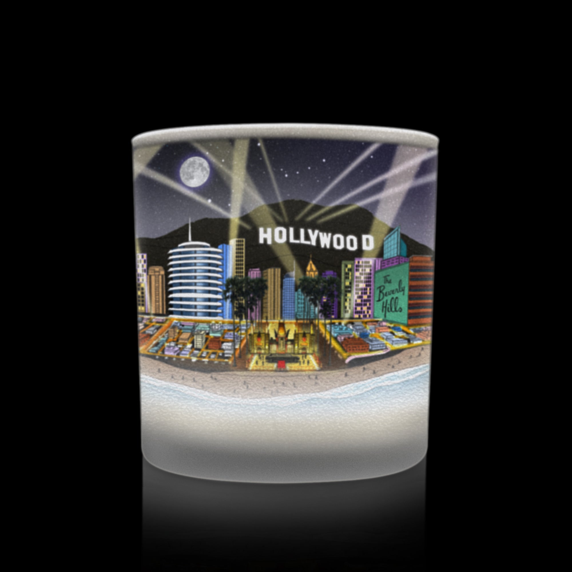 cylindrical glass candle with a Hollywood-themed design.
