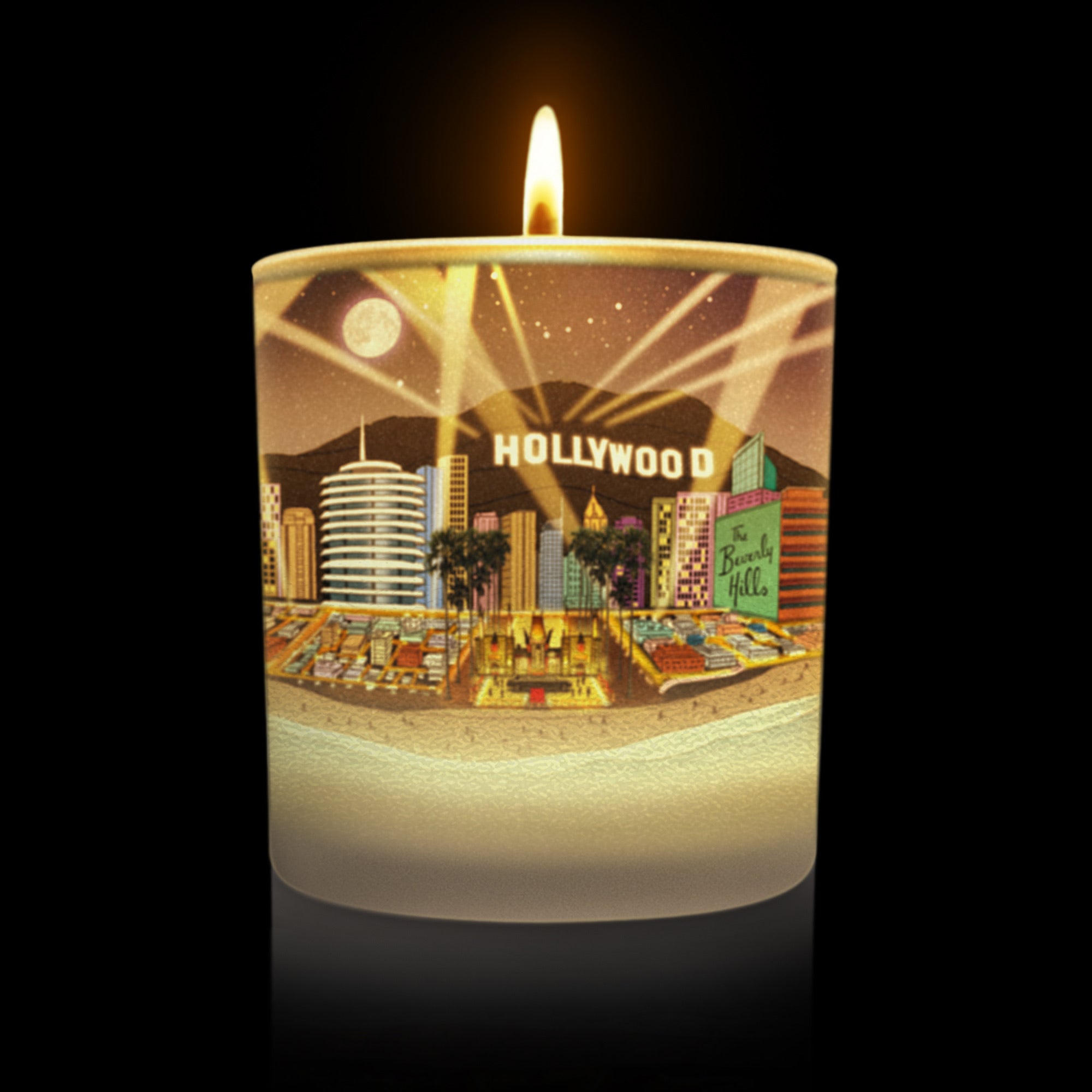 cylindrical glass lit candle with a Hollywood-themed design