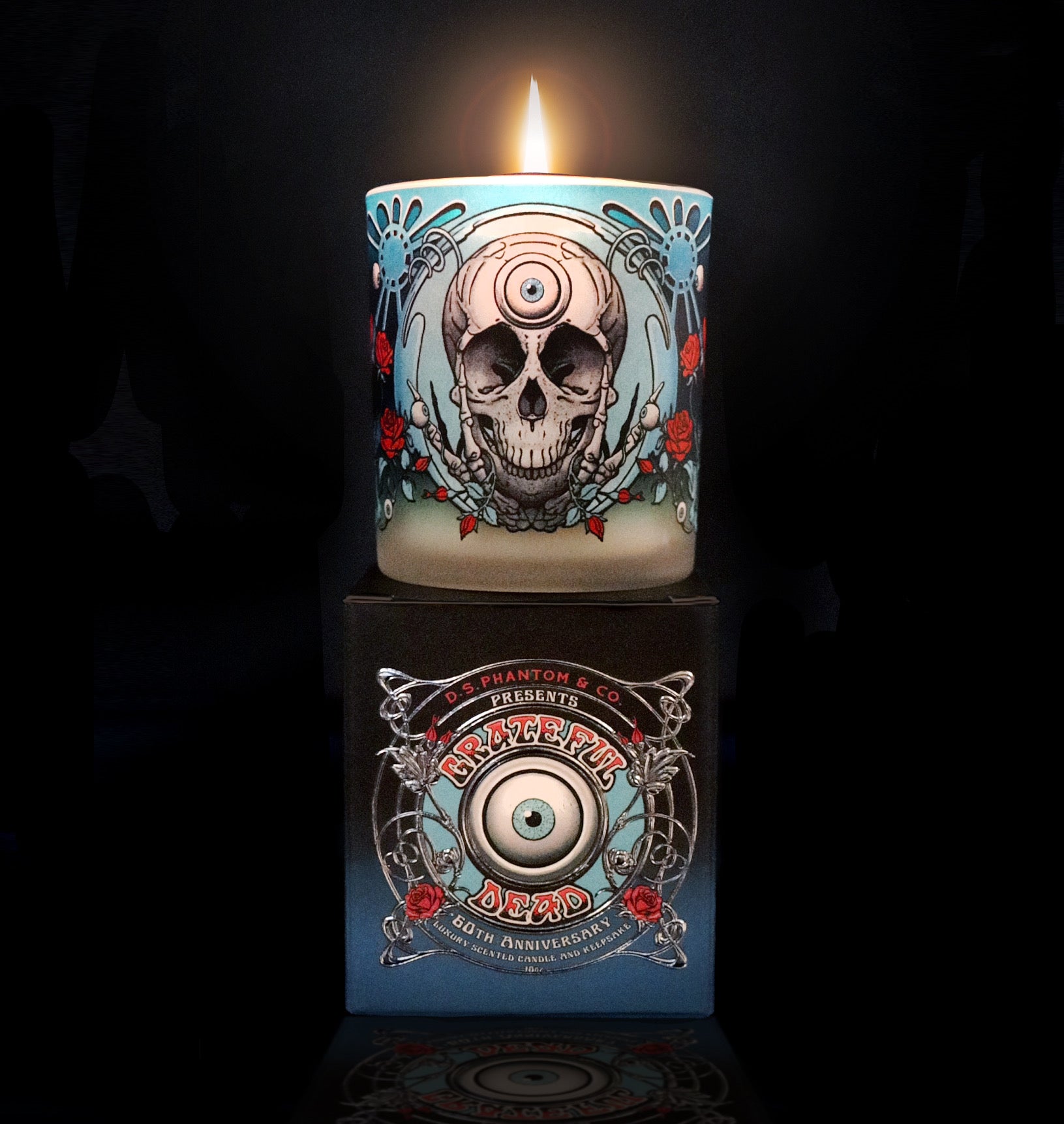 Candle with skull design on a dark background