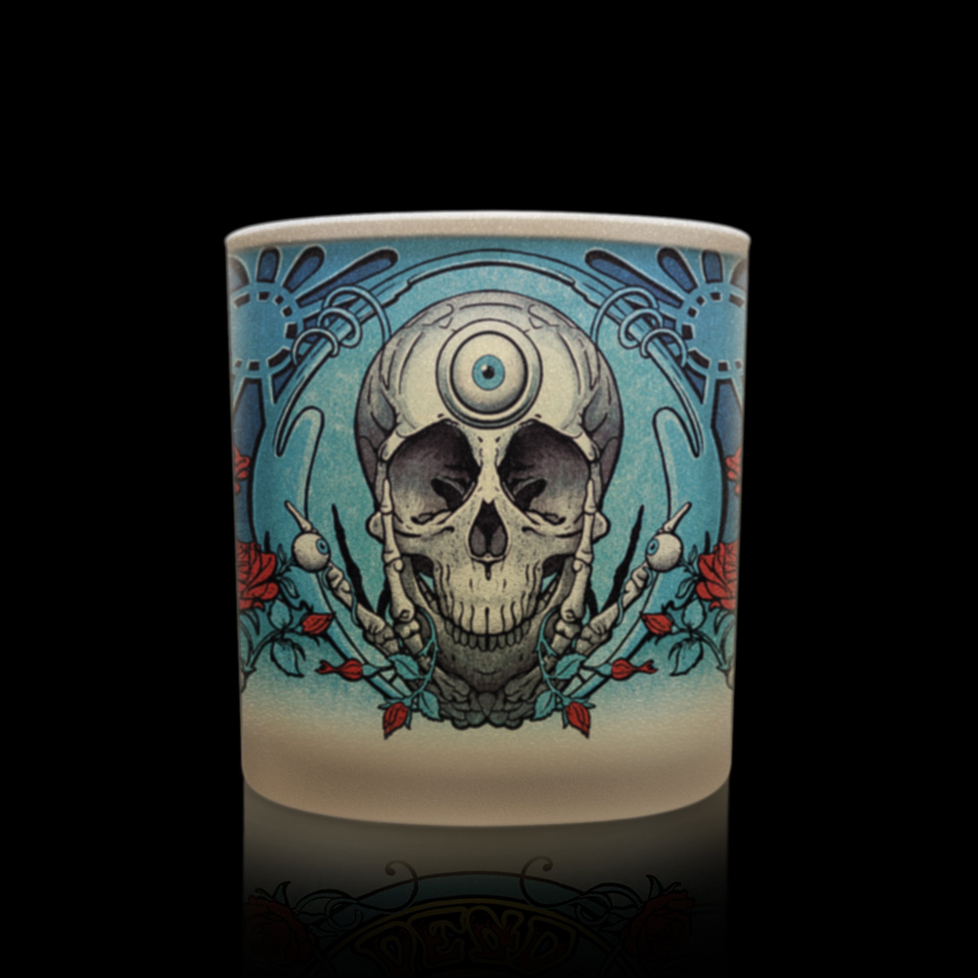 Candle with detailed Grateful Dead skull and floral artwork.