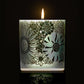 lit Phantom candle featuring 360 artwork of flowers