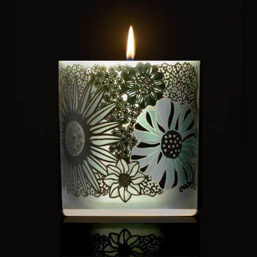 lit Phantom candle featuring 360 artwork of flowers