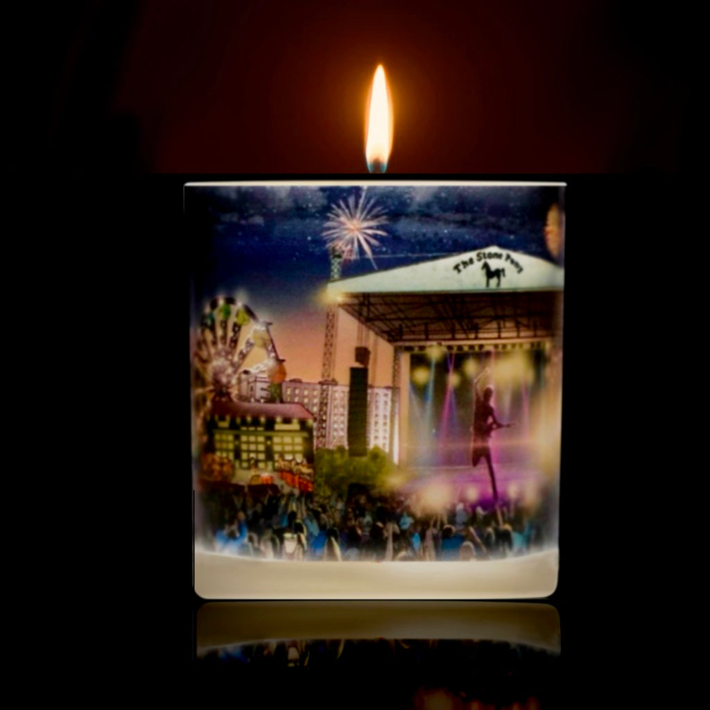 Lit candle depicting artwork of Ashbury Park’s boardwalk  