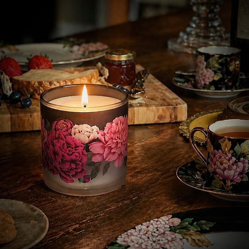 Floral Peonies candle on a wooden table with tea and snacks