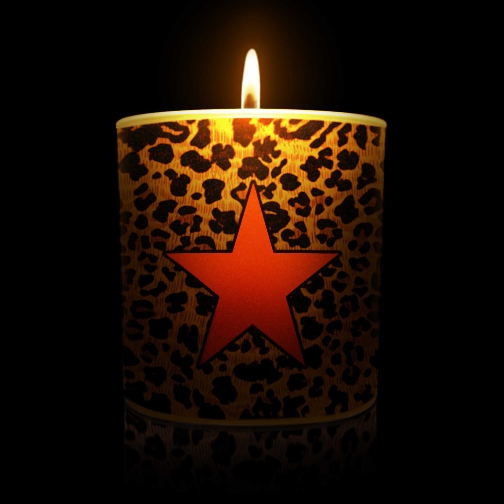 Lit Afraid of the Dark Leopard candle with red star 